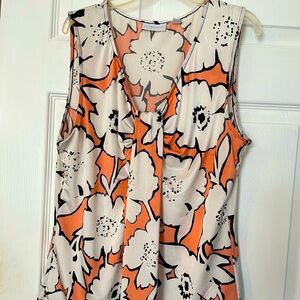 Approx 26in long sleeveless office blouse large white flowers orange background